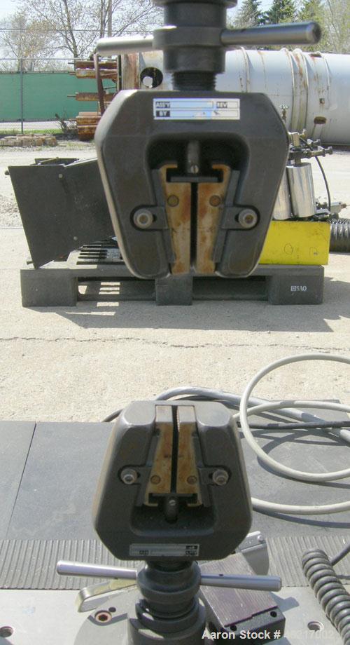 Used Instron tensile tester, model 1122.  Designed and used for testing the physical properties and stretching capabilities of plastics.  Rated 5 KN.  Manually operated clamps. Includes model 4400 di...