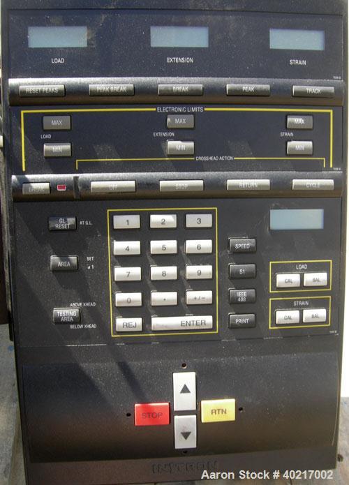 Used Instron tensile tester, model 1122.  Designed and used for testing the physical properties and stretching capabilities of plastics.  Rated 5 KN.  Manually operated clamps. Includes model 4400 di...