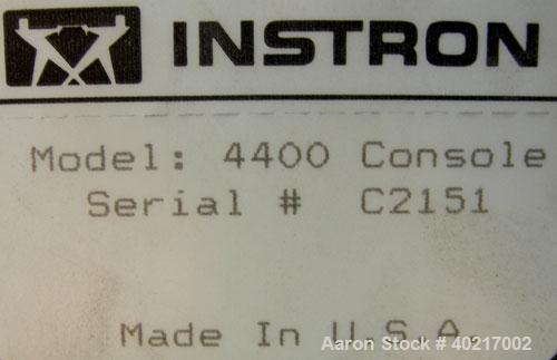 Used Instron tensile tester, model 1122.  Designed and used for testing the physical properties and stretching capabilities of plastics.  Rated 5 KN.  Manually operated clamps. Includes model 4400 di...
