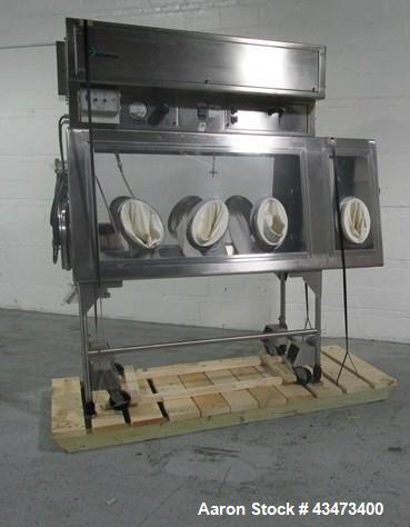 Used La Calhene Isolator, Stainless Steel. Approximately 63" long x 32" wide x 36" high chamber, dual sided with (3) gloves each side, 18" long anti chamber, 16" diameter end access door on stand wit...