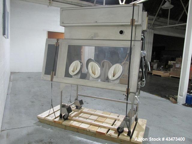 Used La Calhene Isolator, Stainless Steel. Approximately 63" long x 32" wide x 36" high chamber, dual sided with (3) gloves each side, 18" long anti chamber, 16" diameter end access door on stand wit...