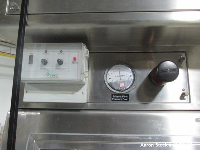 Used La Calhene Isolator, Stainless Steel. Approximately 63" long x 32" wide x 36" high chamber, dual sided with (3) gloves each side, 18" long anti chamber, 16" diameter end access door on stand wit...
