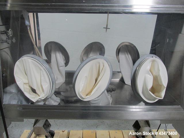 Used La Calhene Isolator, Stainless Steel. Approximately 63" long x 32" wide x 36" high chamber, dual sided with (3) gloves each side, 18" long anti chamber, 16" diameter end access door on stand wit...