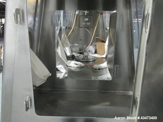 Used La Calhene Isolator, Stainless Steel. Approximately 63" long x 32" wide x 36" high chamber, dual sided with (3) gloves each side, 18" long anti chamber, 16" diameter end access door on stand wit...