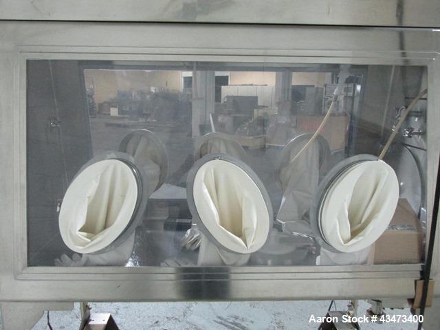 Used La Calhene Isolator, Stainless Steel. Approximately 63" long x 32" wide x 36" high chamber, dual sided with (3) gloves each side, 18" long anti chamber, 16" diameter end access door on stand wit...