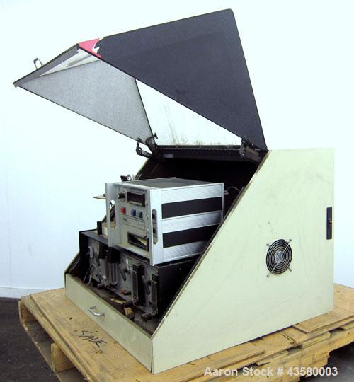 Used Mocon Ox-Tran Twin Oxygen Permeation Measuring Machine, Part# 001-050. Includes a Mocon oxygen transmission rate datalogger, model DL-200, part# 140-029, serial# 0588519, and a Jensen sound cabi...