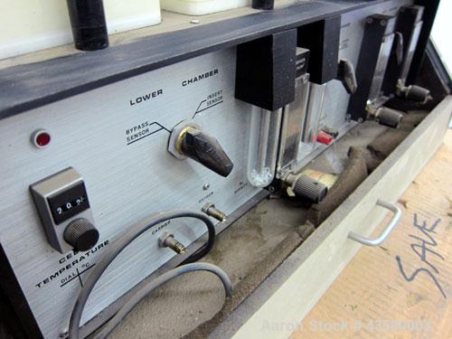 Used Mocon Ox-Tran Twin Oxygen Permeation Measuring Machine, Part# 001-050. Includes a Mocon oxygen transmission rate datalogger, model DL-200, part# 140-029, serial# 0588519, and a Jensen sound cabi...