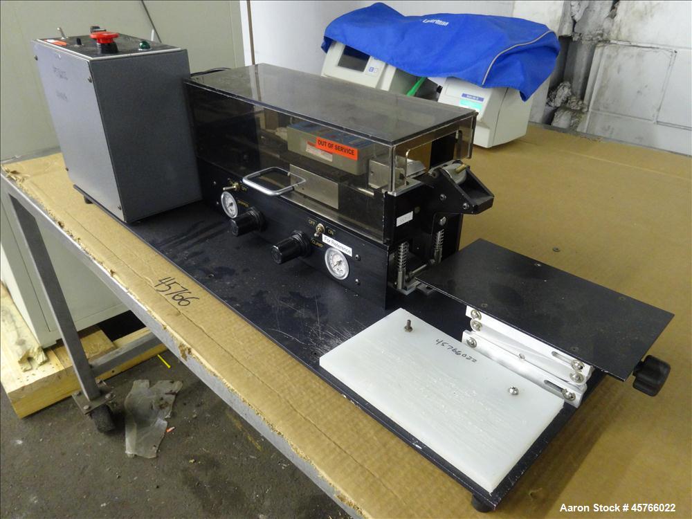 Used Vinatoru Enterprises Tensile/Strength Tester, Model RFD. Can test trays with sides over 1-1/4" and up to 3-1/2" depth. 100% pneumatic grippers, 11 3/4" maximum cross head travel. Multi speed dri...