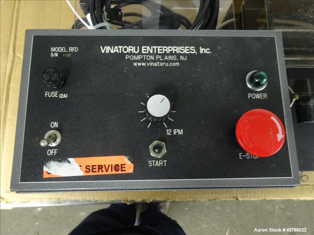 Used Vinatoru Enterprises Tensile/Strength Tester, Model RFD. Can test trays with sides over 1-1/4" and up to 3-1/2" depth. 100% pneumatic grippers, 11 3/4" maximum cross head travel. Multi speed dri...