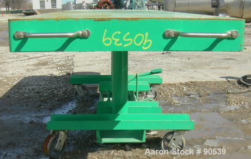 Used: Lexco long deck hydraulic lift table, model STN3010-2F, carbon steel. Approximately 2000 pound lift capacity, 30" wide...