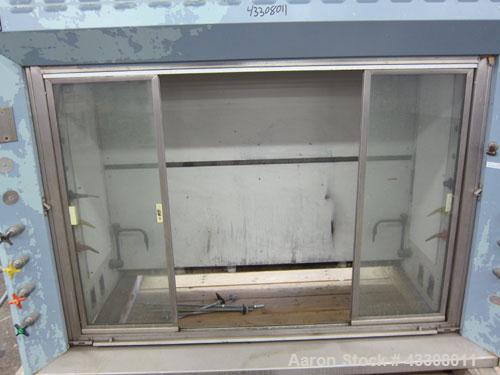 Used St Charles Manufacturing Laboratory Fume Hood. Internal dimensions approximate 62-1/2” wide x 23-1/4” deep. Sliding front doors.