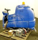 Used Clarke Alto Mini-Max Rider Floor Scrubber. Includes a battery charger, no batteries. Built 2002.