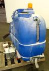 Used Clarke Alto Mini-Max Rider Floor Scrubber. Includes a battery charger, no batteries. Built 2002.