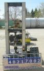 Used Instron tensile tester, model 1122.  Designed and used for testing the physical properties and stretching capabilities of plastics.  Rated 5 KN.  Manually operated clamps. Includes model 4400 di...