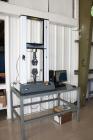 Used Instron 3369 Materials Testing Load Frame. Includes the following accessories:  Model 2630-114 strain gauge extensometer; model 2716-002 wedge action grips; model 2703-006 faces, flat serrated; ...