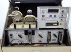 Used Mocon Ox-Tran Twin Oxygen Permeation Measuring Machine, Part# 001-050. Includes a Mocon oxygen transmission rate datalogger, model DL-200, part# 140-029, serial# 0588519, and a Jensen sound cabi...