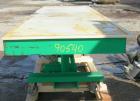Used: Lexco long deck hydraulic lift table, model STN3010-2F, carbon steel. Approximately 2000 pound lift capacity, 30