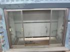 Used St Charles Manufacturing Laboratory Fume Hood. Internal dimensions approximate 62-1/2” wide x 23-1/4” deep. Sliding front doors.