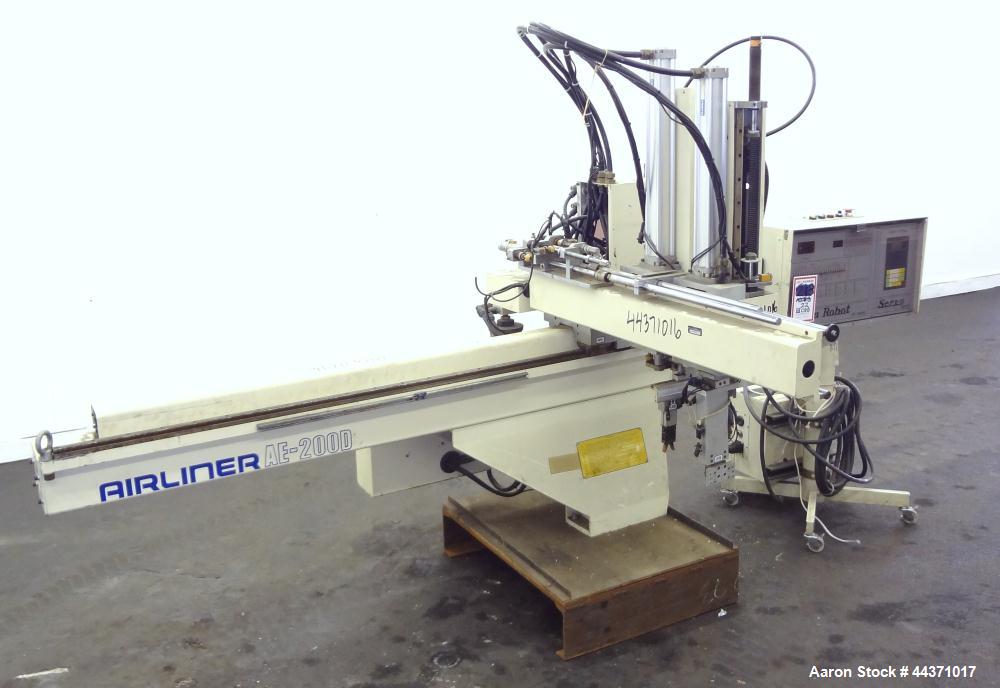 Used Yushin America Airliner AE-200D Robot. With a servo traverse and two pneumatic axes. Includes a model YC-3000 portable controller. Built 1993.