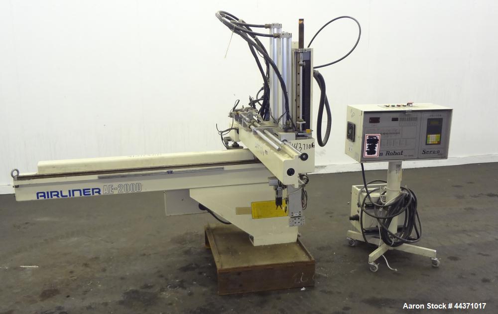 Used Yushin America Airliner AE-200D Robot. With a servo traverse and two pneumatic axes. Includes a model YC-3000 portable controller. Built 1993.