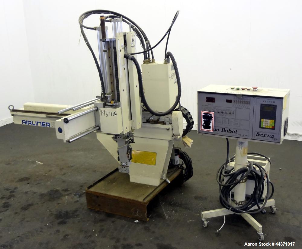 Used Yushin America Airliner AE-200D Robot. With a servo traverse and two pneumatic axes. Includes a model YC-3000 portable controller. Built 1993.