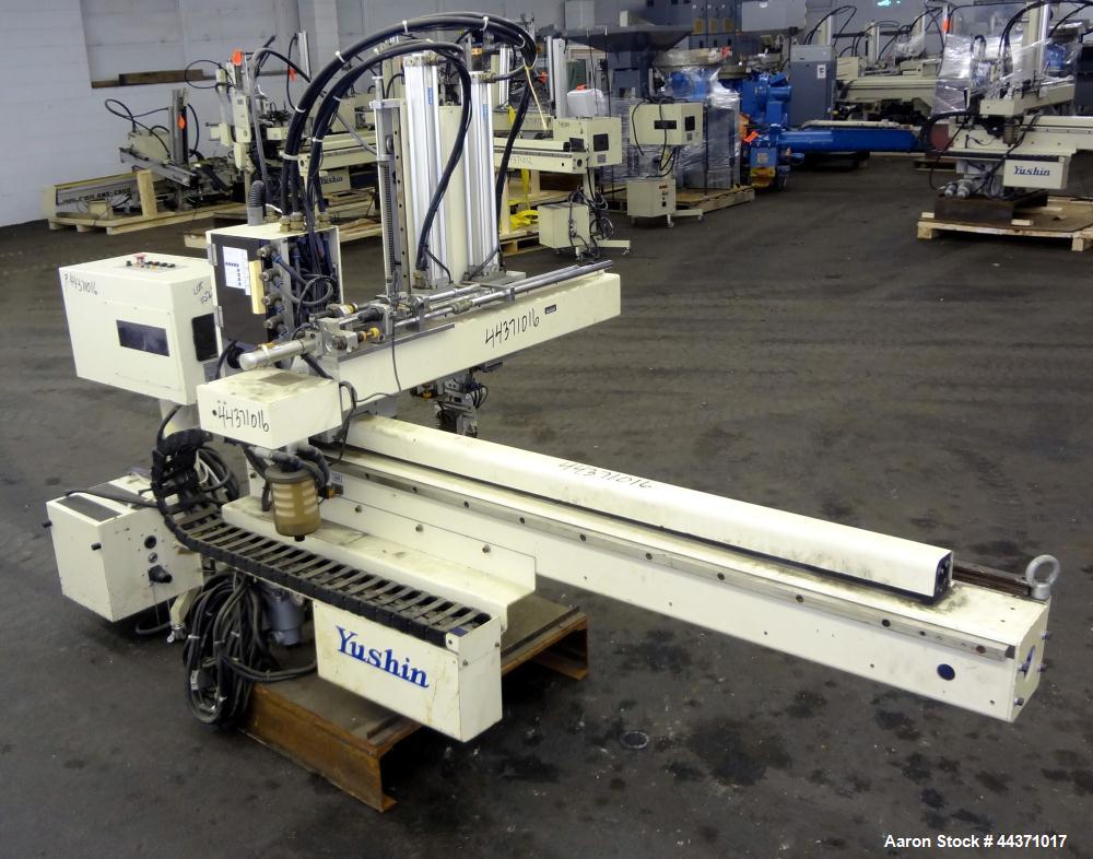 Used Yushin America Airliner AE-200D Robot. With a servo traverse and two pneumatic axes. Includes a model YC-3000 portable controller. Built 1993.