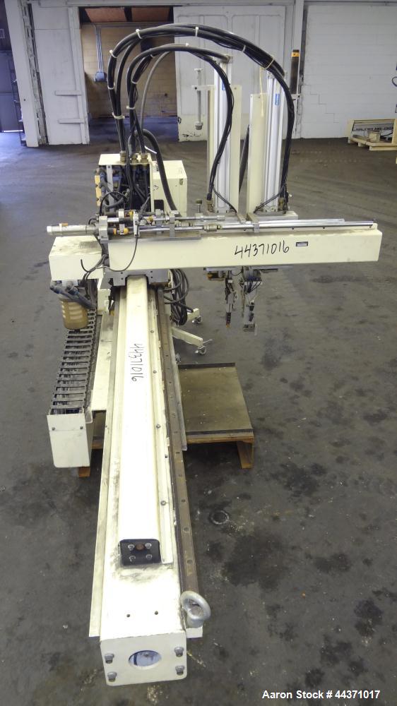 Used Yushin America Airliner AE-200D Robot. With a servo traverse and two pneumatic axes. Includes a model YC-3000 portable controller. Built 1993.