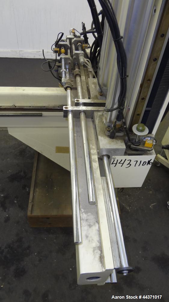 Used Yushin America Airliner AE-200D Robot. With a servo traverse and two pneumatic axes. Includes a model YC-3000 portable controller. Built 1993.