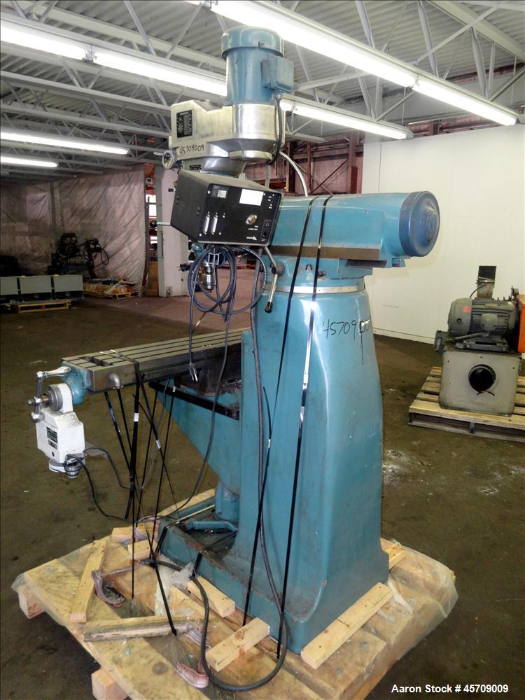 Used- Enco Variable Speed Vertical Milling Machine. Table size 49" long x 9" wide. Approximate table travels: longitudinal 3...