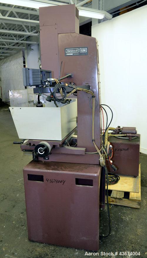 Used Hansvedt Ram Type EDM, Model Benchman. Work table size 9.4" x 14.2", table travel 5.5" x 8.5", work tank size 16" x 24" x 11" high, platen to table 18" maximum, 10" minimum, ram travel 8", plate...