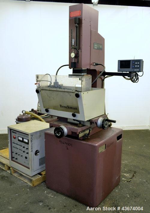 Used Hansvedt Ram Type EDM, Model Benchman. Work table size 9.4" x 14.2", table travel 5.5" x 8.5", work tank size 16" x 24" x 11" high, platen to table 18" maximum, 10" minimum, ram travel 8", plate...
