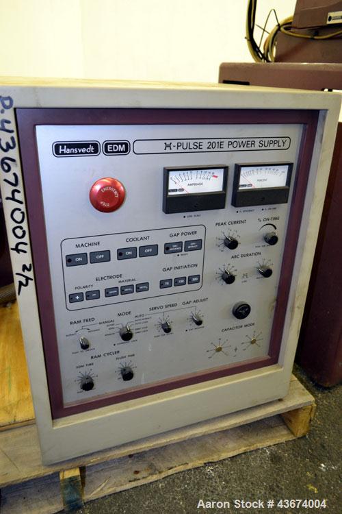 Used Hansvedt Ram Type EDM, Model Benchman. Work table size 9.4" x 14.2", table travel 5.5" x 8.5", work tank size 16" x 24" x 11" high, platen to table 18" maximum, 10" minimum, ram travel 8", plate...