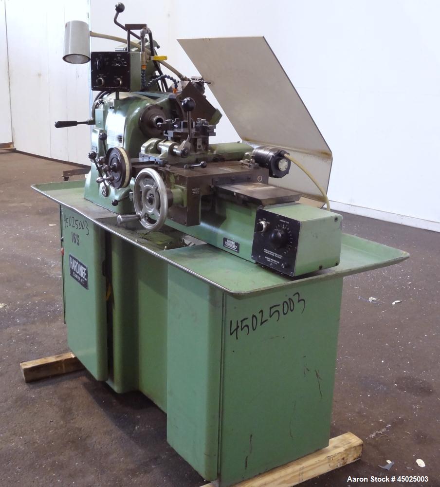 Used Hardinge HC Lathe. Approximate spindle capacity jaw chucks 5" max. Distance, face of turret to spindle, 13". Spindle speeds (variable) 125-3000 rpm. Spindle nose 2-3/16" /10. RH cross slide trav...