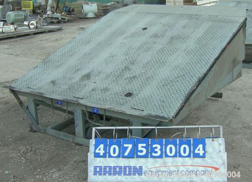 Used Serco Mechanical Dock Leveler, model W8730, carbon steel. 83" wide x 81" long plate with a lip extension. Approximate 30,000 pound capacity.