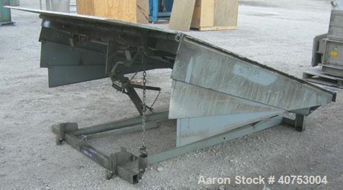 Used Serco Mechanical Dock Leveler, model W8730, carbon steel. 83" wide x 81" long plate with a lip extension. Approximate 30,000 pound capacity.