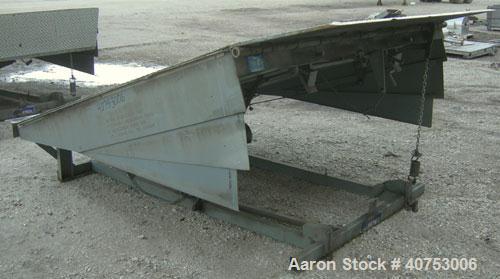 Used Serco Mechanical Dock Leveler, model W8730, carbon steel. 83" wide x 81" long plate with a lip extension. Approximate 30,000 pound capacity.