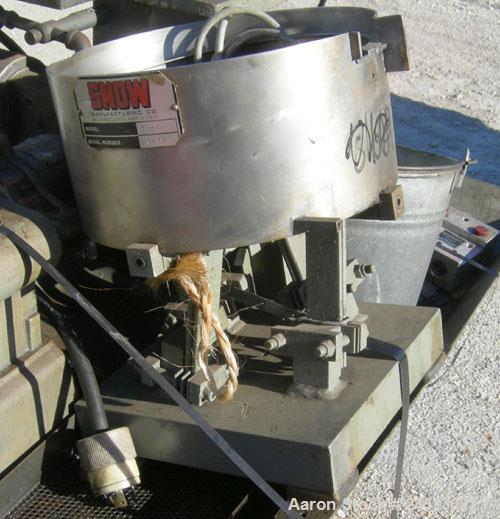 Used Snow Manufacturing Single/Horizontal Spindle Tapping Machine, Model HT-1-S. With vibratory bowl feed hopper and feed chute for the automatic (in/out) tapping of holes up to 6mm diameter in nuts ...