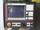 Used Motionmaster 5 axis CNC router. Track system: X axis travel 65', Y axis travel 19', Z axis travel 10'; one spindle, 7 hp Perske motor, Fagor controls; wired remote with start, stop and feed rate...