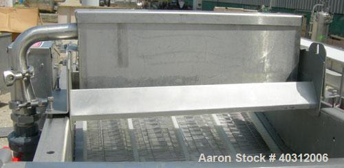 Used Stein all purpose batter applicator, model APB-24, 304 stainless steel. 24" wide x 96" long wire mesh belt, driven by an approximately 1 hp gearmotor. Dual curtain overflow with overflow and a 1...