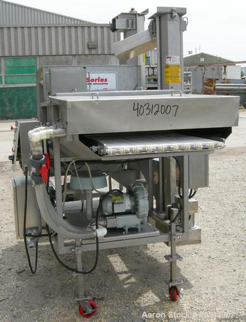 Used Stein breading applicator, model E-24J, 304 stainless steel. "J" configuration. Breader capacity 50-90 pounds. 25" wide x 96" long wire mesh belt, driven by a 2 hp, 3/60/230/460 volt, 1725 rpm g...