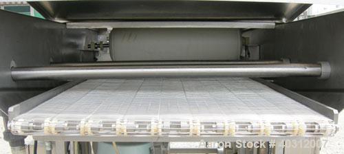 Used Stein breading applicator, model E-24J, 304 stainless steel. "J" configuration. Breader capacity 50-90 pounds. 25" wide x 96" long wire mesh belt, driven by a 2 hp, 3/60/230/460 volt, 1725 rpm g...