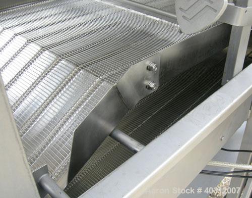 Used Stein breading applicator, model E-24J, 304 stainless steel. "J" configuration. Breader capacity 50-90 pounds. 25" wide x 96" long wire mesh belt, driven by a 2 hp, 3/60/230/460 volt, 1725 rpm g...