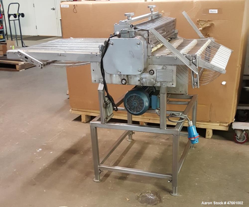Used Formax Cuber-Perforator, Model MC.  27. 26" Wide usable belt, 1.5 hp drive, 460V/3PH/60HZ, 1.5 Amps,  scores portions up to 1.25 " thick, top and bottom scoring, with infeed and exit conveyors. ...