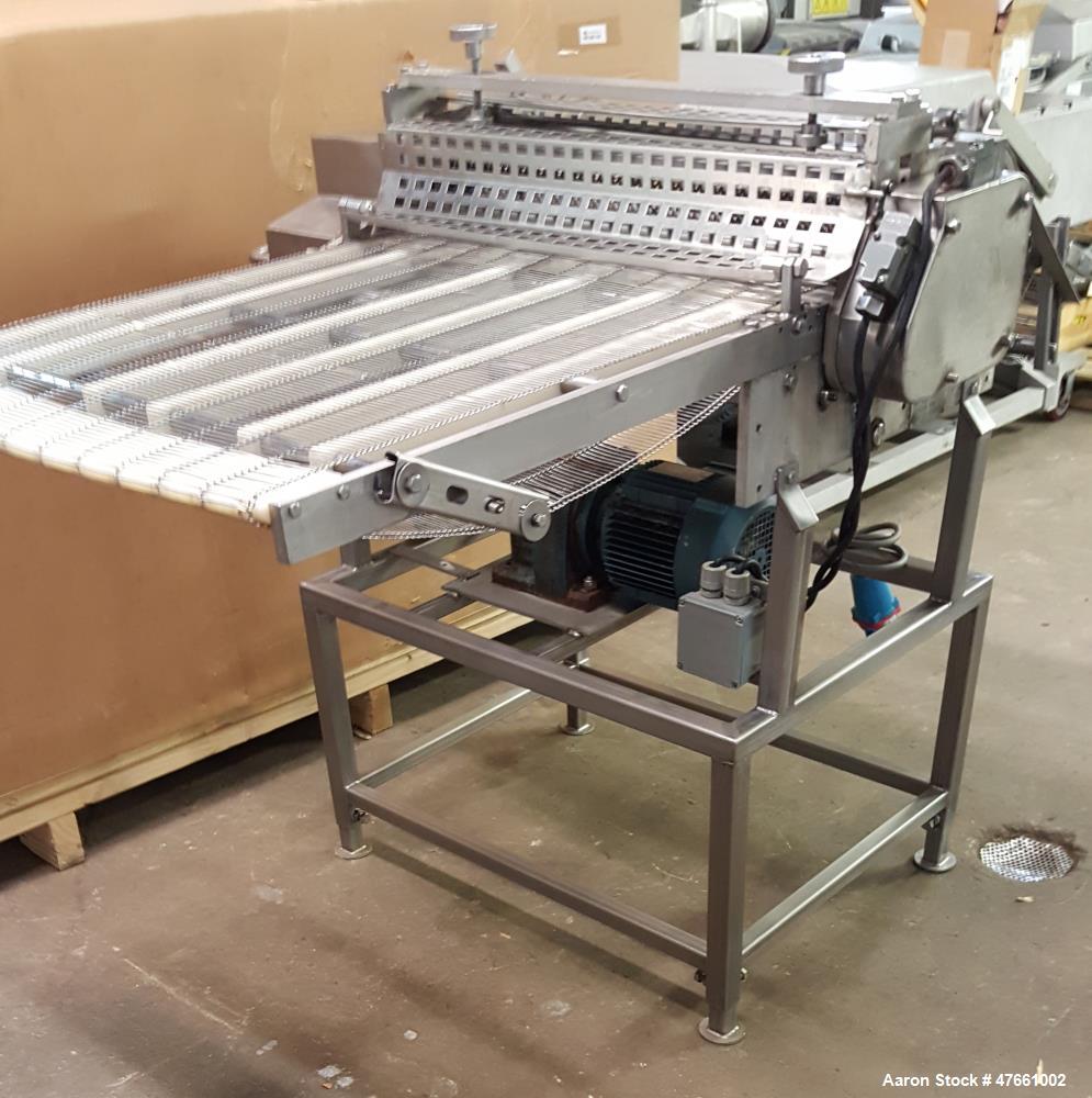 Used Formax Cuber-Perforator, Model MC.  27. 26" Wide usable belt, 1.5 hp drive, 460V/3PH/60HZ, 1.5 Amps,  scores portions up to 1.25 " thick, top and bottom scoring, with infeed and exit conveyors. ...