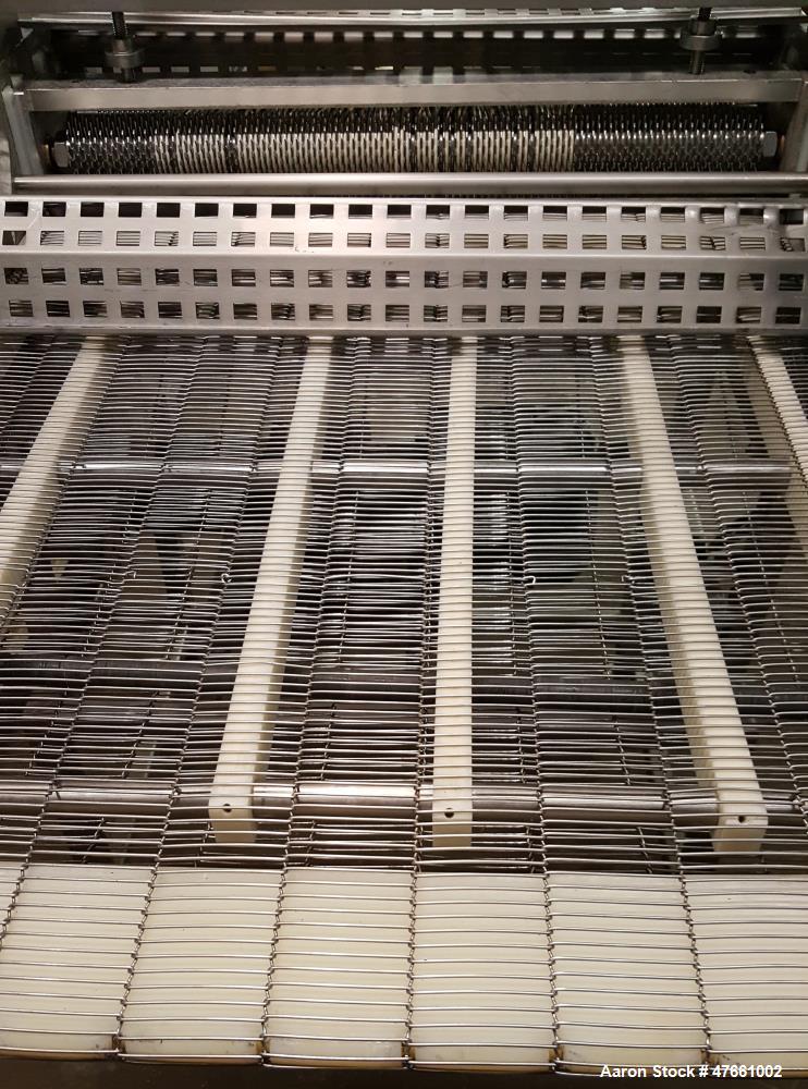 Used Formax Cuber-Perforator, Model MC.  27. 26" Wide usable belt, 1.5 hp drive, 460V/3PH/60HZ, 1.5 Amps,  scores portions up to 1.25 " thick, top and bottom scoring, with infeed and exit conveyors. ...