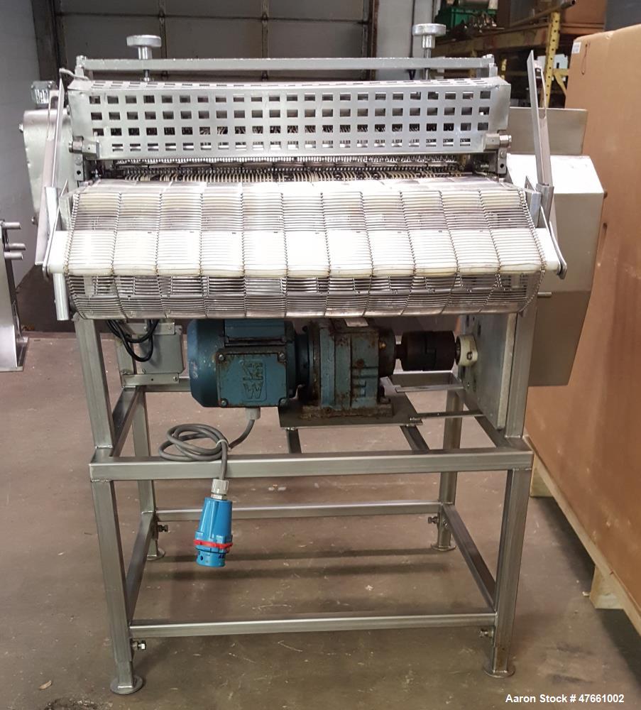 Used Formax Cuber-Perforator, Model MC.  27. 26" Wide usable belt, 1.5 hp drive, 460V/3PH/60HZ, 1.5 Amps,  scores portions up to 1.25 " thick, top and bottom scoring, with infeed and exit conveyors. ...