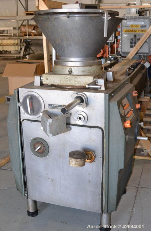 Used Handtmann Vacuum Filler, Model VF10-50, Code 65/25, Carbon steel. Top feed hopper with mixing arm, driven by a 0.55kw, 3/60/200 volt, 1700 rpm motor. Removable vane feeder driven by a 1.5/4.4kw,...