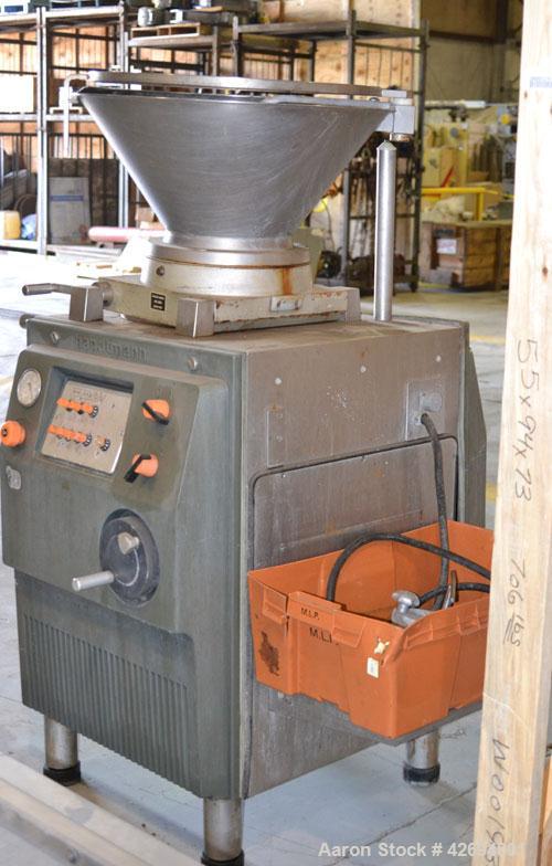 Used Handtmann Vacuum Filler, Model VF10-50, Code 65/25, Carbon steel. Top feed hopper with mixing arm, driven by a 0.55kw, 3/60/200 volt, 1700 rpm motor. Removable vane feeder driven by a 1.5/4.4kw,...