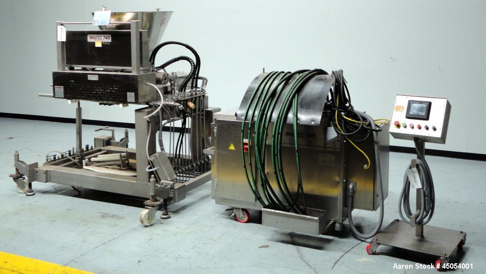 Used NuTEC Manufacturing Hydraulic Provatec 745 Patty Forming Machine. Approximately 15 to 65 strokes per minute, varies on portion size. Has hopper capacity of 400 pounds, usable mold plate area 16"...