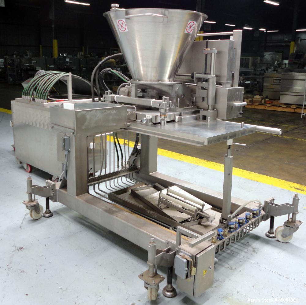 Used NuTEC Manufacturing Hydraulic Provatec 745 Patty Forming Machine. Approximately 15 to 65 strokes per minute, varies on portion size. Has hopper capacity of 400 pounds, usable mold plate area 16"...